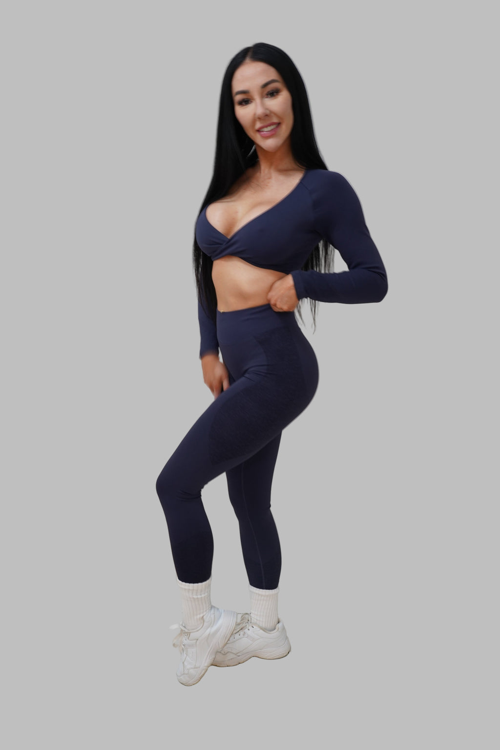 woman wearing navy blue athletic outfit.