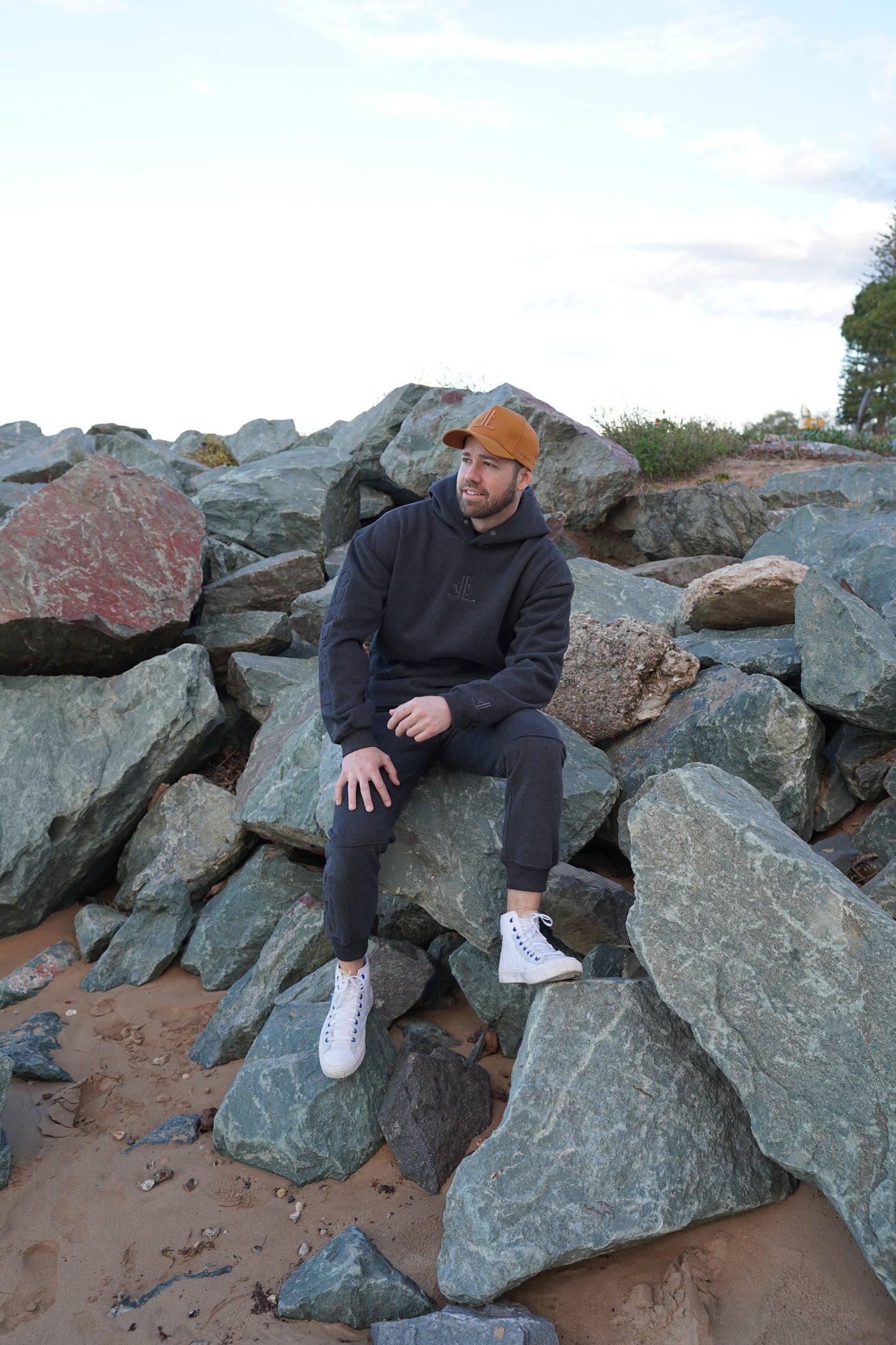 Person lying on rocks with a scenic background