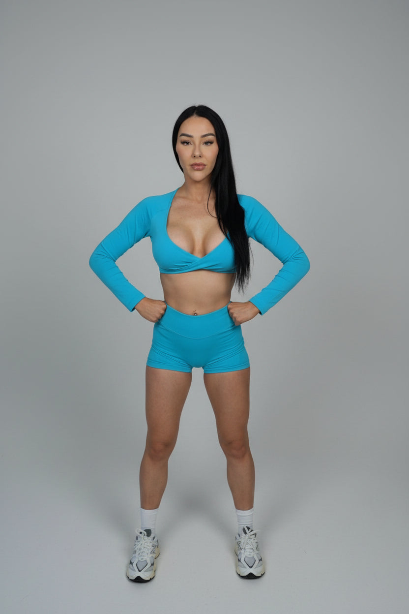 Person wearing a blue athletic outfit on a black background
