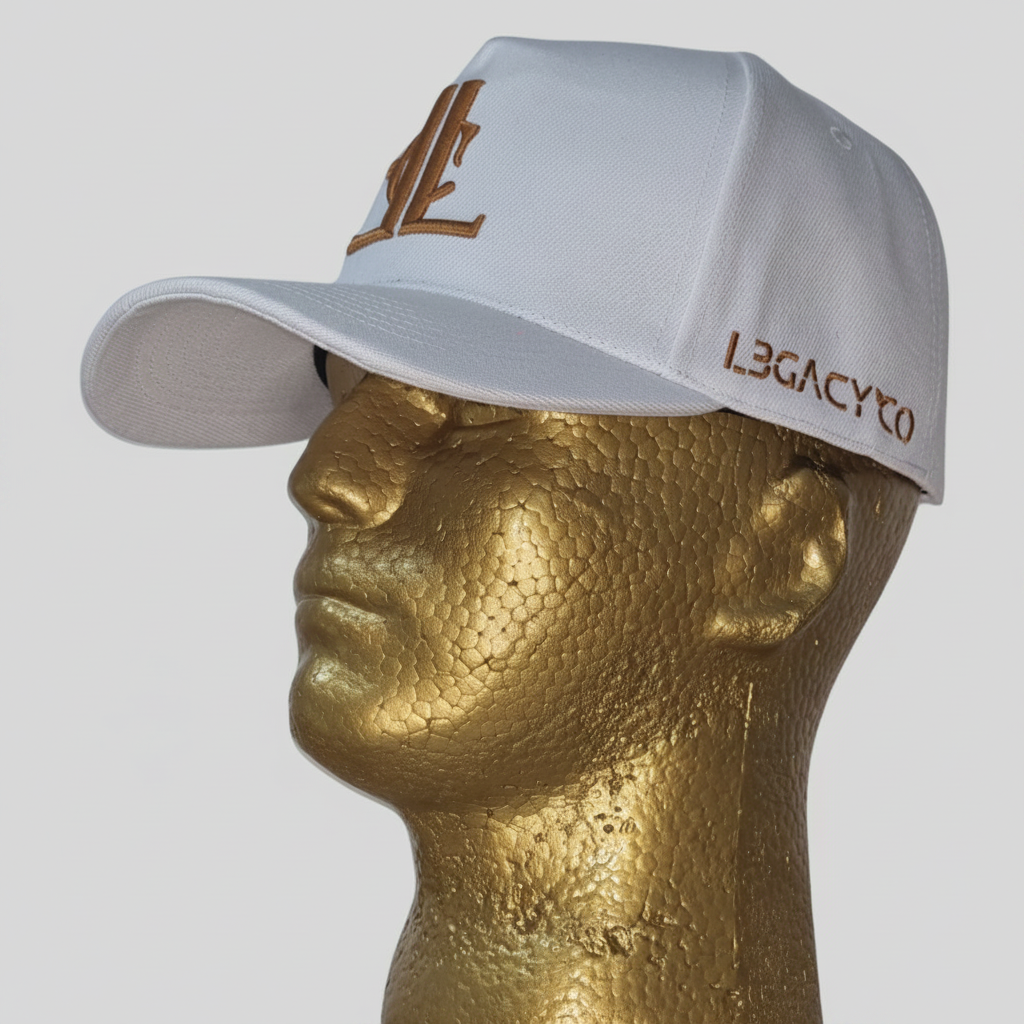 A white baseball cap with ' LegacyCo ' written on it, displayed on a golden mannequin head.