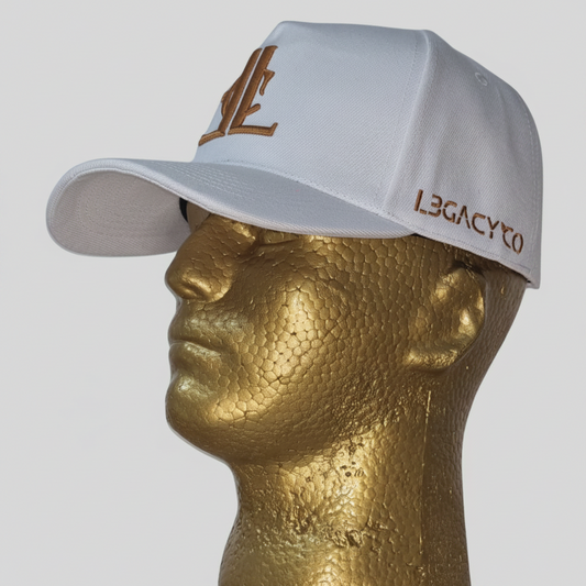 A white baseball cap with ' LegacyCo ' written on it, displayed on a golden mannequin head.